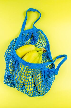 concept no plastic. bananas in a blue mesh bag. free plastic