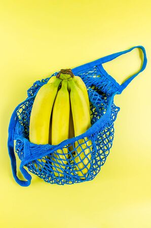 concept no plastic. bananas in a blue mesh bag. free plasticの写真素材