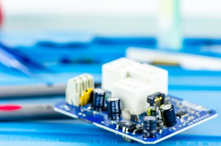 The electrician's workplace. Electronics. Schemes soldering iron