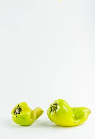 ugly food. green pepper on a white background. copy spaceの写真素材