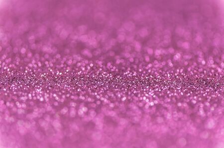 Abstract glitter pink lights background. de-focused