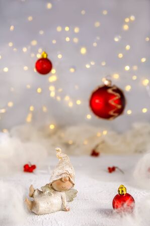 Christmas. New Year's Eve. angels on the background of Christmas trees, garlandsの写真素材