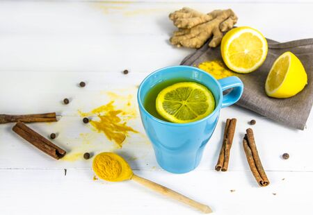 tea with turmeric. body, liver detox. Lemon, ginger, pepper cinnamon herbal cleansing drink conceptの写真素材
