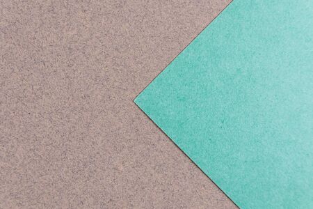 Multicolor paper diagonal background with arrow of trendy mint and craft colors. Top view, copy...