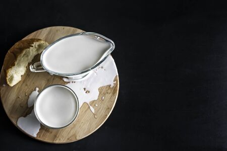 dairy products milk and cream on a black background with copy spaceの写真素材