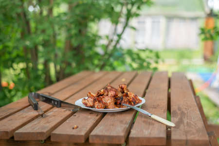 plate with kebab on a wooden tableの写真素材