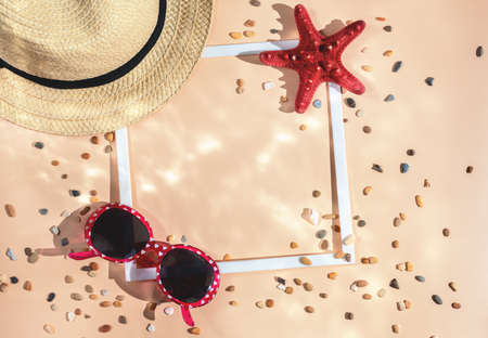 summer flat lay. sea, travel. hat, starfish, shell and white frame.の写真素材