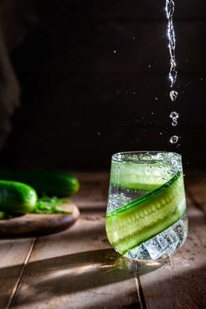 cucumber soft summer drink on a dark backgroundの写真素材