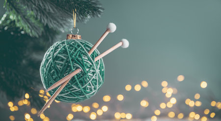 green Christmas ball in the form of a ball of threads with spokes on the Christmas tree. needlework....