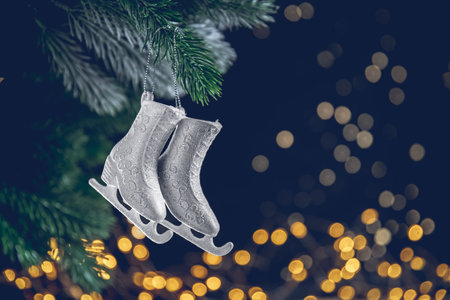Christmas tree toy in the form of skates for figure skating hangs on the Christmas treeの写真素材