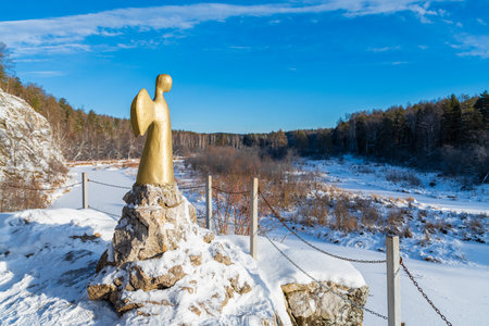 2022.11.27. Sverdlovsk region, Ural, Russia. Statue of the angel of one hope in winter. Serga river in Deer streams national Park.の写真素材