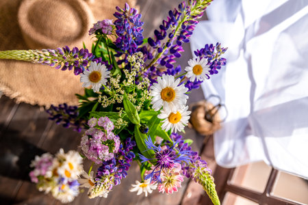 vase with wildflowers. lupines, daisies, cornflowers. summer timeの写真素材