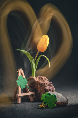 concept spring. freakebana. Trendy card with yellow tulip and Four-leaf clover. the concept of St....