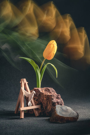 concept spring. freakebana. Trendy card with yellow tulip and hummingbird. Creative image of flowers...