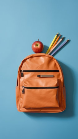 Backpack with different school stationery on light blue background. Concept school, education, back to schoolの素材