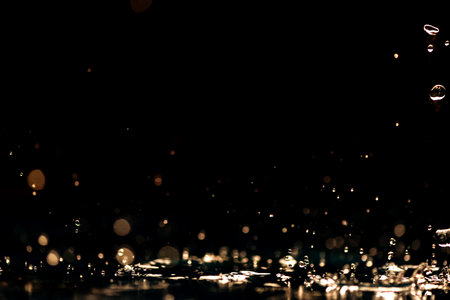 rain background. water droplets, splashes on a black backgroundの写真素材