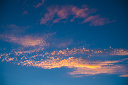 Beautiful unusual clouds in the sky at sunset. Sunlightの写真素材