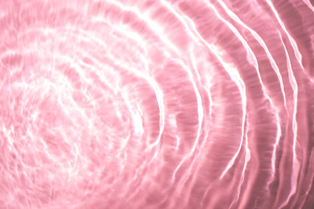 Beautiful water texture with waves. pink color, water backgroundの写真素材