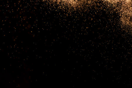 small drops of rain, snow on a black background. wind. Natural background. goldenの写真素材
