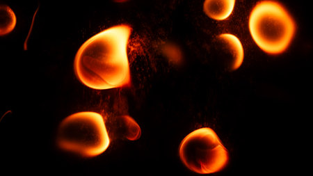 Beautiful liquid red, orange fire texture on black background. Fire in wavesの写真素材