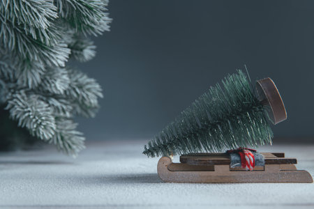 a sleigh with christmas tree in the snow. christmas, new year background, with copy spaceの写真素材