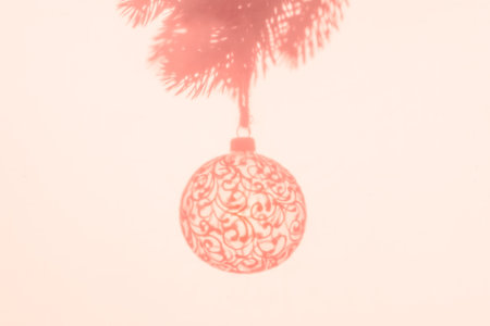 Christmas ball on Christmas tree, creative photo, new year, christmas. Color of the Year 2024 Peach Fuzz. Selective focusの写真素材