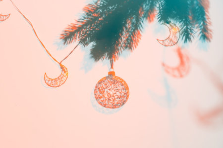 Christmas ball on Christmas tree, creative photo, new year, christmas. Color of the Year 2024 Peach Fuzz. Selective focusの写真素材