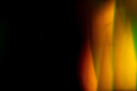 orange golden warm bright highlights on a black background. for overlay to create effect of sun rays...