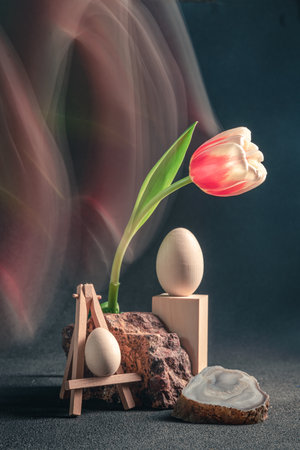 concept spring freakebana. Trendy card with red-white tulip and Easter eggs. easter concept. Creative image of flowers with blurred trail, fantasy motion effect, motion blurの写真素材