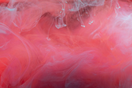 clouds of red and blue smoke on black background, clouds of paint in water, aquarium, abstract background, textureの写真素材