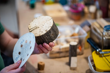 cute teen girl at a master class making a craft from wood, exhibition of crafts, crafts fair, education, master classes, DIY wood productの写真素材