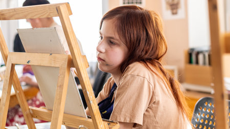 Cute girl in art studio oil painting. Hobbies, Relaxation, Art Therapyの写真素材