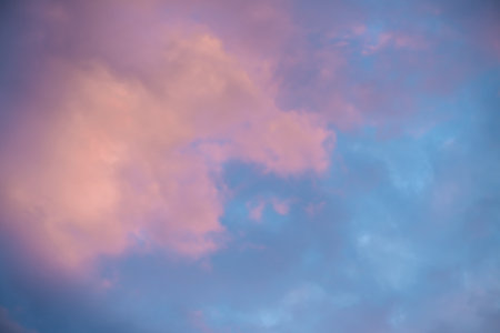 Beautiful clouds in the sky at sunset, pink and blue, natural background, romance, magicの写真素材