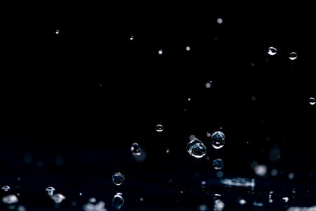 rain background. water droplets, splashes on a black backgroundの写真素材