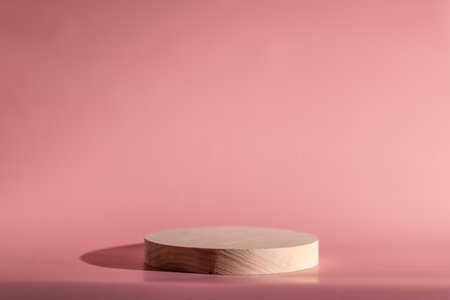 Wooden Round Pedestal On Pink Background, For Product Display And Advertisingの写真素材