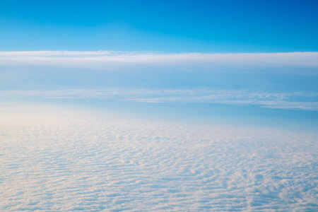 Top view of clouds, view from airplane, natural white backgroundの写真素材