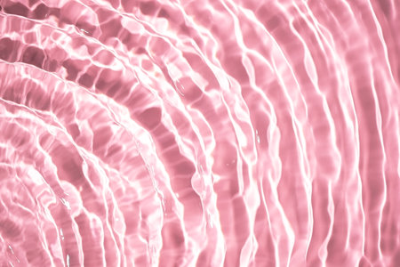 Beautiful water texture with waves. pink color, water backgroundの写真素材