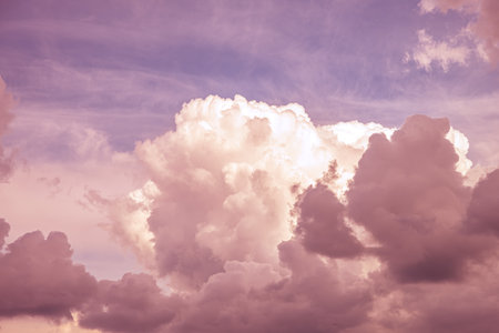 Magic pink cumulus clouds on blue sky at sunrise sunset nature background wallpaper