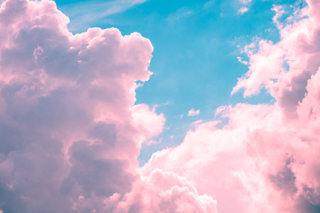 Pink cumulus clouds on blue sky at sunrise sunset nature background