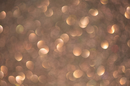 Shiny brown glitter luxury background, blurry sparkling lights texture, perfect for backgrounds, textiles, wallpapersの写真素材