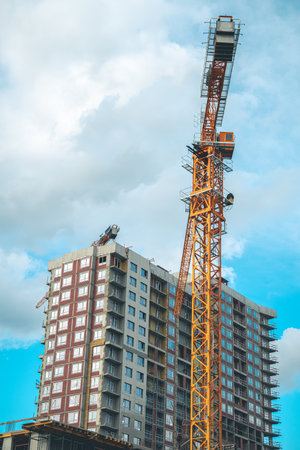 Construction of a multi-storey building in the city, construction craneの写真素材