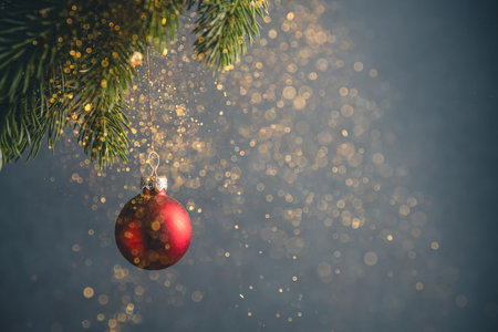 Red Christmas ball on a Christmas tree. Golden glitter, holiday, new year, christmasの写真素材