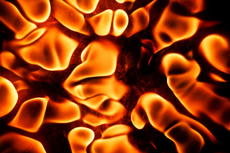 Beautiful liquid red, orange fire texture on black background. Fire in wavesの写真素材