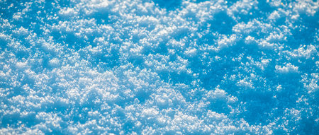 Natural snow background, snow glitters and shimmers like a rainbow in the sun, natural snow textureの写真素材
