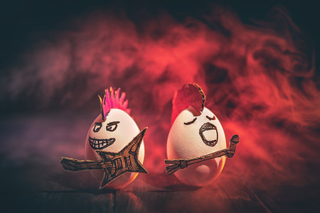 Creative photo. Egg rockers with guitar and microphone. Creative Easter Cardの写真素材