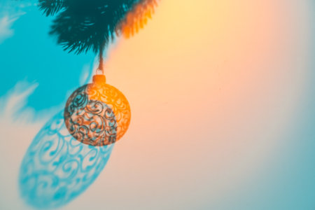 Christmas ball on Christmas tree, creative photo with shadow, new year, christmas. Blue, peach, orange, Selective focusの写真素材