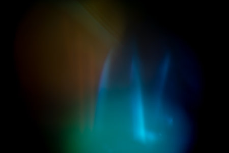 Multicolored bright highlights on a black background. for overlay to create a festive, vibrant effect, abstract backgroundの写真素材