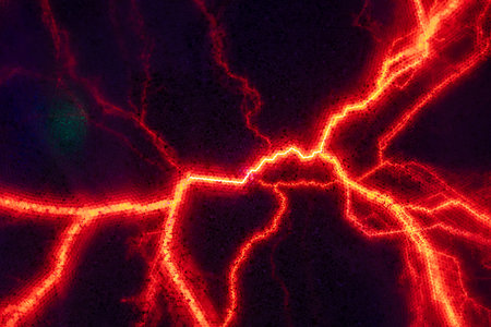 Glowing plasma filaments create a mesmerizing display of red and orange light against a dark background, evoking a sense of energy and otherworldly beautyの写真素材