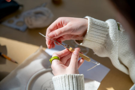 cute teenage girl at carpet embroidery workshop, craft exhibition, craft fair, education, workshops,...