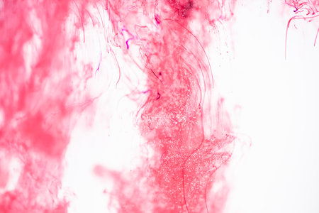 viva magenta colored smoke on a white backgroundの写真素材
